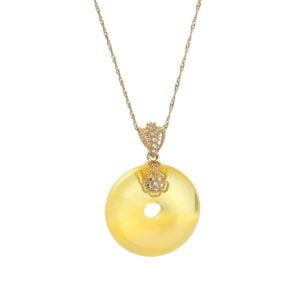 Unikatowa złota zawieszka bursztynowa w kształcie donata z cyrkoniami