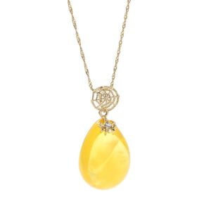 Unikatowa złota zawieszka bursztynowa w kształcie sopla z cyrkoniami