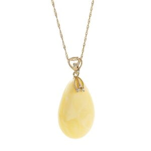 Unikatowa złota zawieszka bursztynowa w kształcie sopla z cyrkoniami